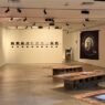 Suasana ruang pameran dengan berbagai karya fotografi dan instalasi seni