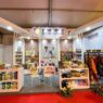 Tampilan depan booth pameran Pemerintah Kabupaten Jember berdesain modern elegan yang memajang ragam produk UMKM unggulan serta plakat Juara 1 Desain Stand Terbaik.