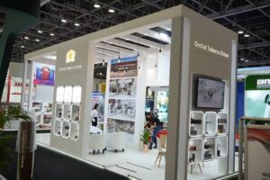 Stand booth pameran Orchid Tobacco Dubai bernuansa putih modern pada gelaran World Tobacco Asia 2026 di Grand City Convention & Exhibition Centre Surabaya.
